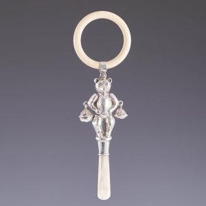 A Sterling Silver Rattle And Teething Ring Soother Birmingham 1927