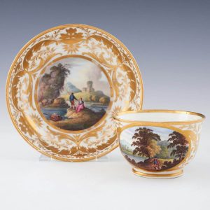 A Derby Porcelain Named View Landscape Tea Cup and Saucer c1820