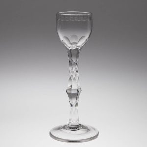 A Very Tall 18th Century Facet Cut Stem Engraved Cordial Glass c1770