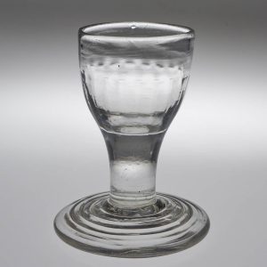 An 18th Century Terraced Foot Dram Glass c1760