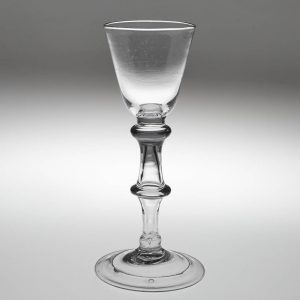 A Georgian Balustroid Stem Tax Glass c1750