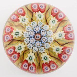 A Vasart Nine Spoke Radial Concentric Yellow Paperweight c1950